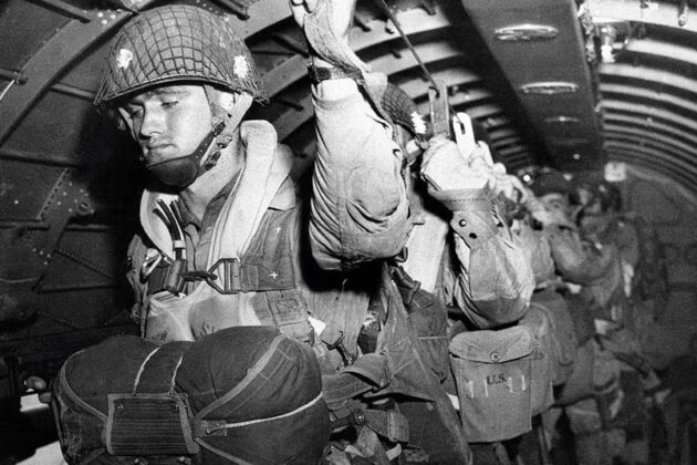 A group of paratroopers in line for a jump in WWII