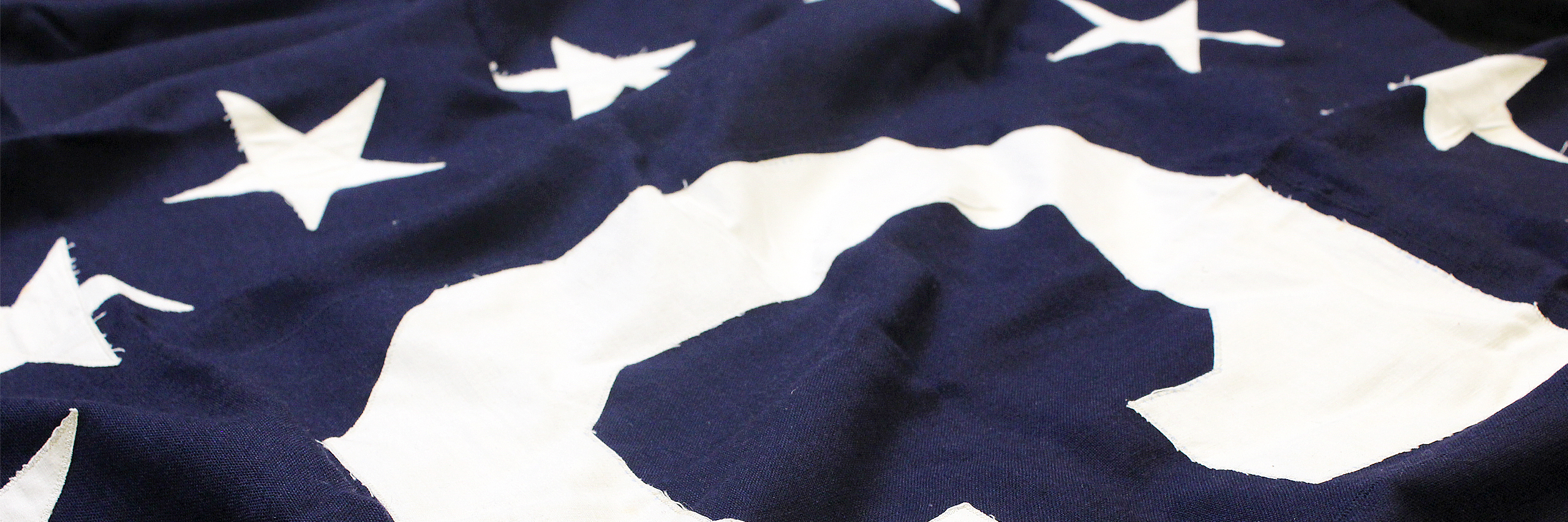 Consular Affairs Flag, white C surrounded by 13 white stars on a field of blue