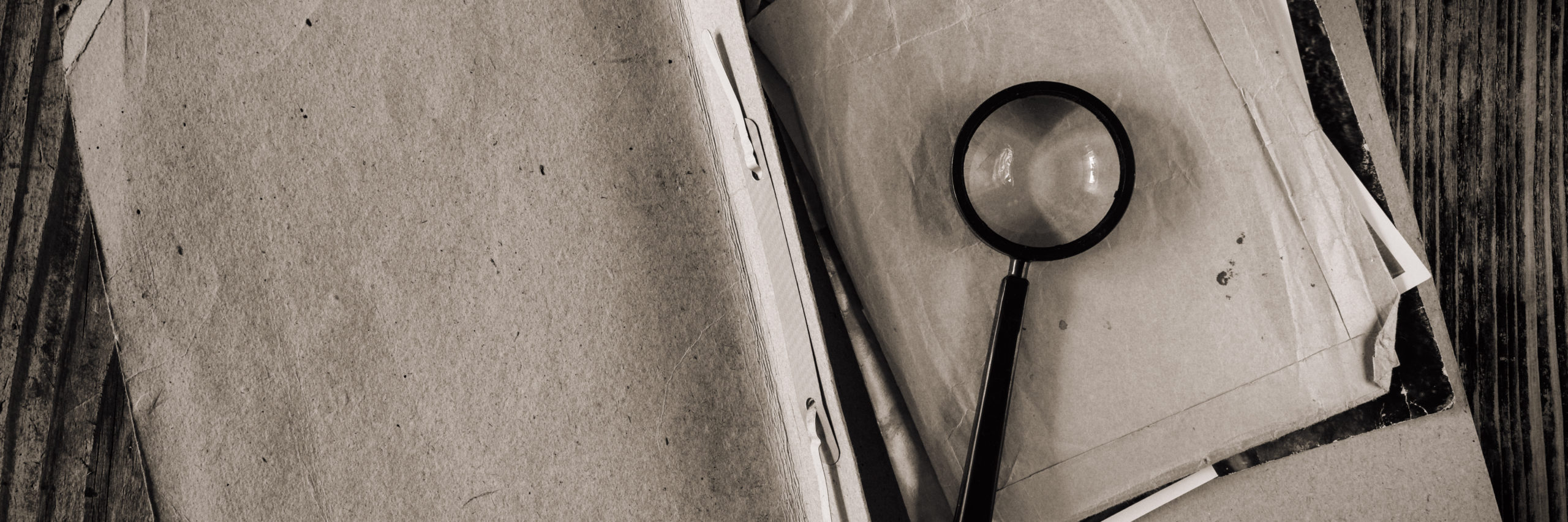 Magnifying glass with vintage documents retro investigation spy discovery concept - Image