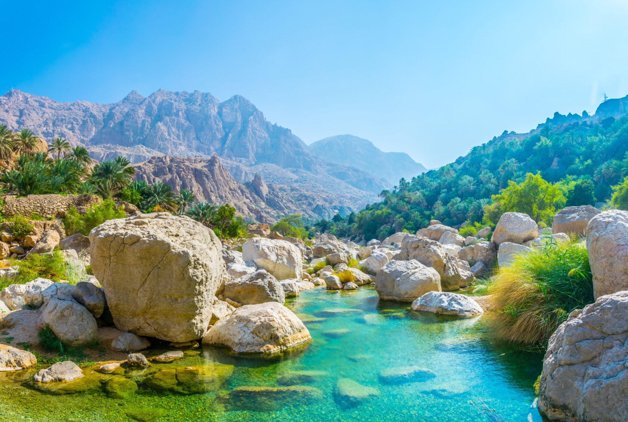 Lagoon with turqoise water in Wadi Tiwi in Oman.