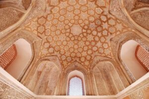 A patterned, decorative ceiling.