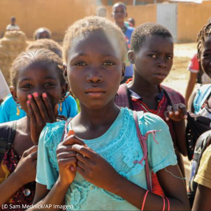 group of African children facing camera with somber expressions