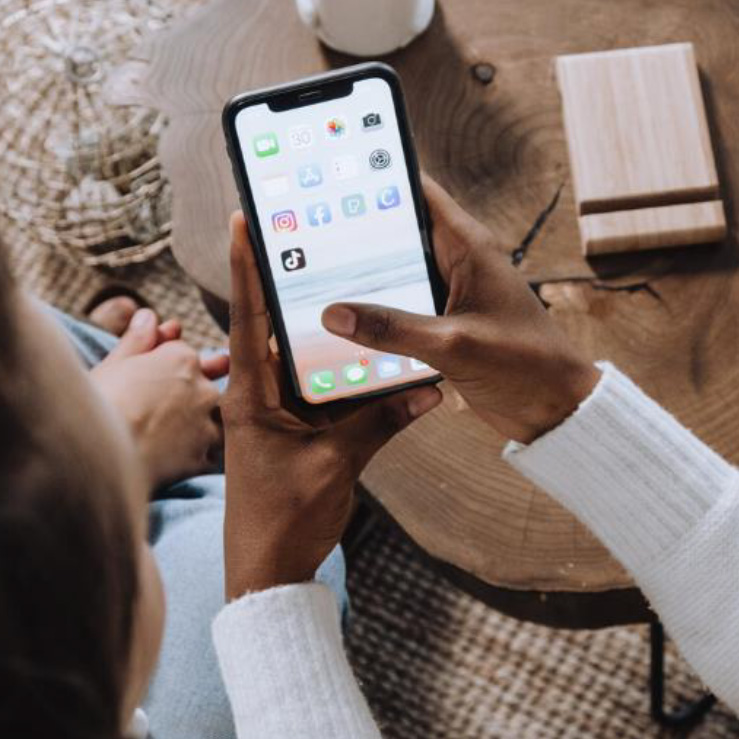 overhead perspective of two people looking at a smartphone