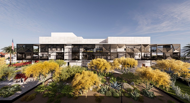 A modern building with a white facade and dark geometric structures. 